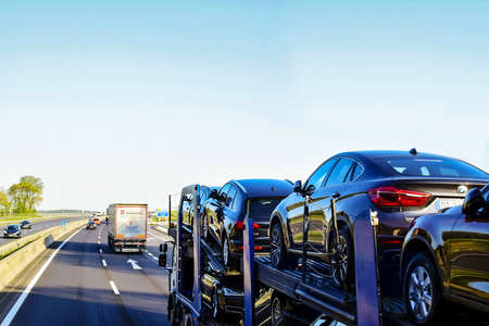 Austria, Vienna - may 2019: Auto transportation of cars on autobahn in special transport trailer....