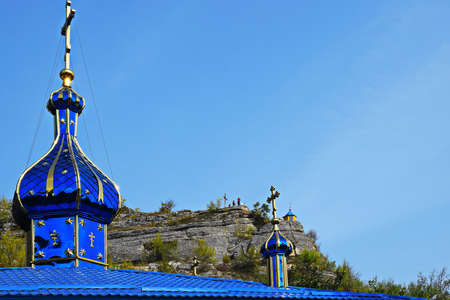 Fragment of roof with domes of Orthodox church overlooking chapel. Orthodox Monastery "Holy Trinity", village of Saharna, Moldova. The monastery was founded in 1459.の写真素材