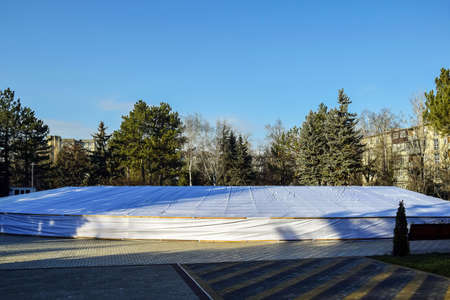Shelter of pool from winter frost. Winter conservation of park fountain ensemble. Protection of...