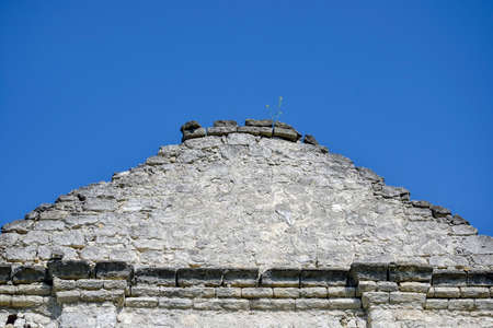 Ruined roof of an ancient building against clear sky. Brickwork, ruins, ancient architecture, historical heritage. Copy space.の写真素材