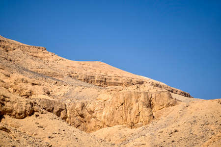 Desert landscape in Egypt. View of sandy hill against clear blue sky. Copy space for text. selective focus.の写真素材