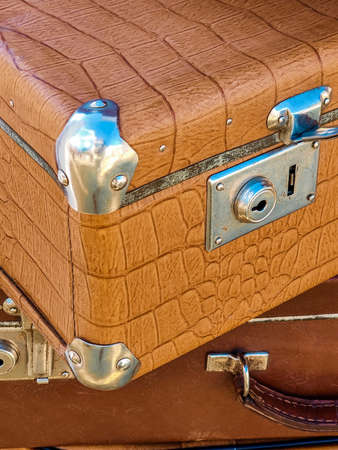 Vintage leather suitcases are stacked. close-up. copyspace. selective focus.