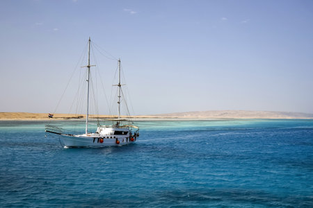 Vacation, active recreation on yacht on sunny day. Tourists are resting on white yacht. Holidays on Red Sea, resort, leisure and adventure, travel. Hurghada, Egypt - October 2021のeditorial素材