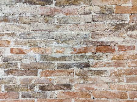 The background and texture of the brickwork of an ancient wall, full frame. selective focus.
