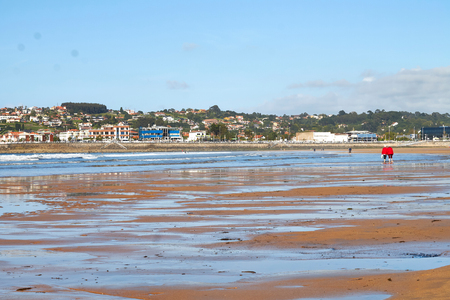 People walking in San Lorenzo beach.の写真素材