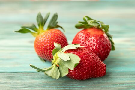 A cake with fruit on top of a tableの写真素材