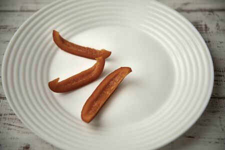 Bulgarian red pepper slices on white plate