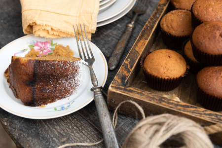 a piece of pie on plate with fork and mini cakes