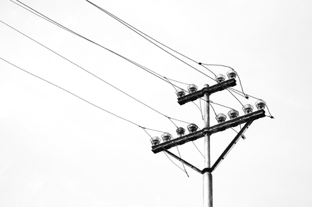 old electricity or telegraph pole, white wire and cablesの写真素材