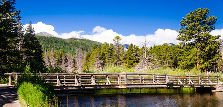 view of a wooden bridge over the river, example of rural architecture on the mountain.の写真素材