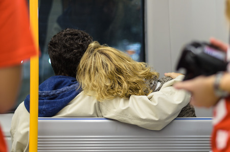 a couple of love hug each other looking through the glassの写真素材