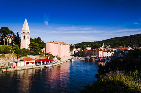 aerial view of a scenic small village in istria at sunset.  veli losinj harbourのeditorial素材