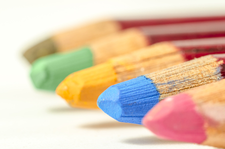 group of coloured pencil in line. different colors only the bue pencil on focus. school. drawing.の写真素材