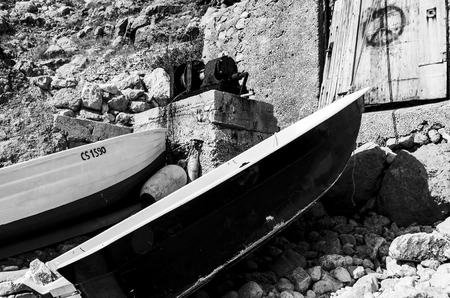 view of two small boat anchired at shoreの写真素材