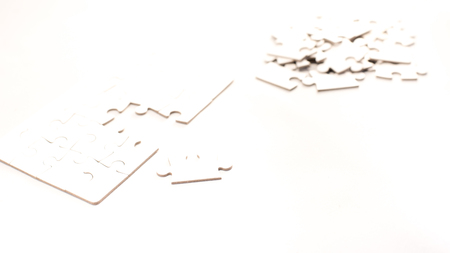 white jigsaw/puzzle whit one gap, symbol of problem solvingの写真素材