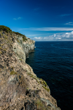 view of the volcano's cliff in terceira. seascape in azores, portugal.の写真素材