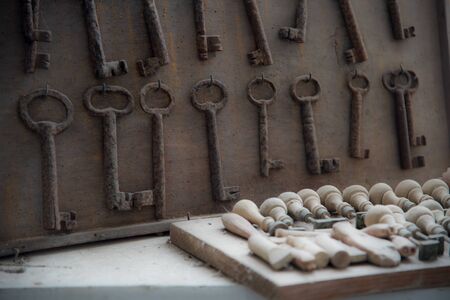 still life with old rusted keys and vintage stampの写真素材