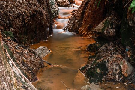 view of a river with hot thermal iron water. azores. portugal