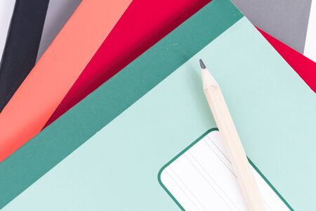 pencil and school  notebook of different colors.の写真素材