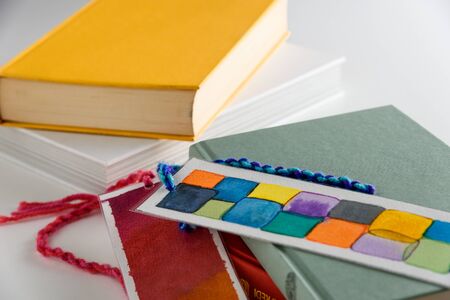 colorful bookmark on a closed green book. education. reading.の写真素材