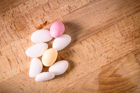 still life of sugared almonds on a wooden table. wedding, newborn celebrationの写真素材