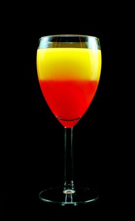 Sunrise Cocktail isolated on a black background の写真素材
