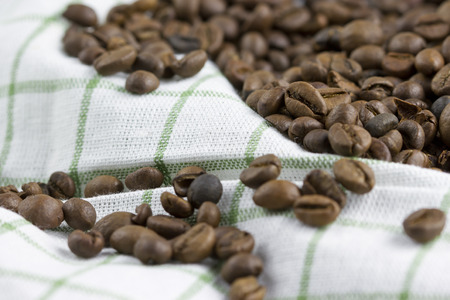 coffee beans on white textileの写真素材