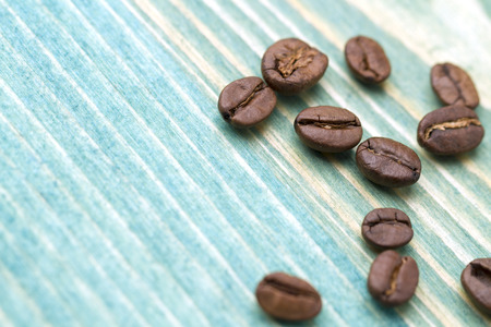 Coffee beans on blue wood backgroundの写真素材