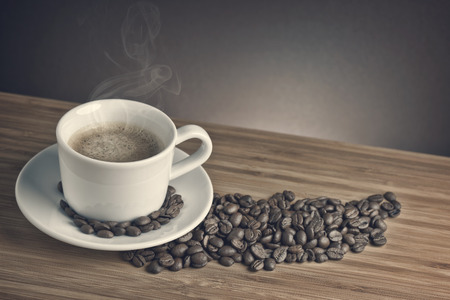 Cup of coffee on wooden backgroundの写真素材