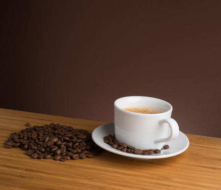 Coffee cup top view on wooden table backgroundの写真素材