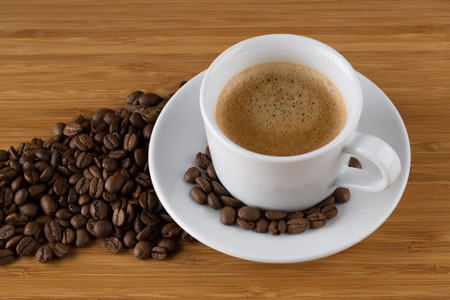 Coffee cup top view on wooden table backgroundの写真素材