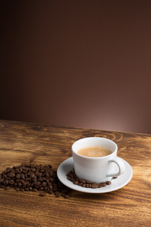 Coffee cup top view on wooden table backgroundの写真素材