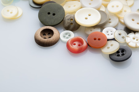 Pile of sewing buttons isolated on white