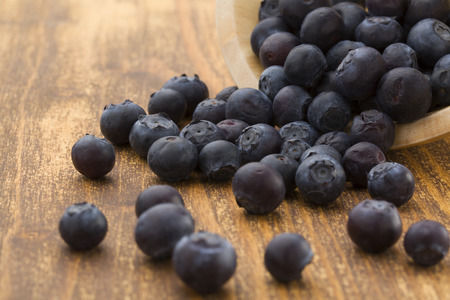 blueberries in wooden bowlの写真素材