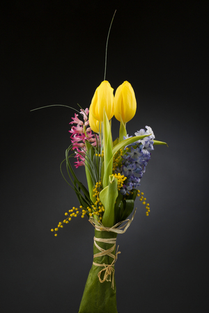 Spring tulips, hyacinth over black  backgroundの写真素材