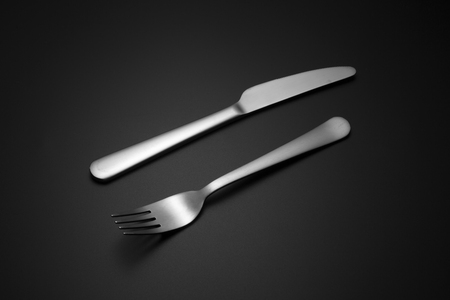 cutlery over black backgroundの写真素材