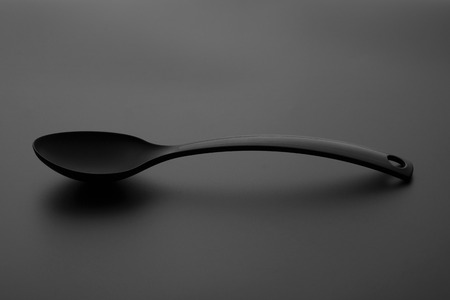 spoon over gray backgroundの写真素材
