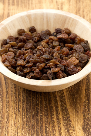 delicious raisins in white bowlの写真素材