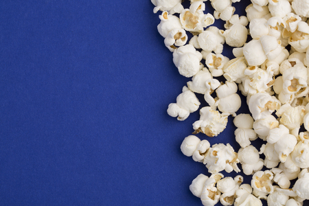 Popcorn on blue backgroundの写真素材