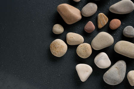 colorful sea pebbles with water dropsの写真素材
