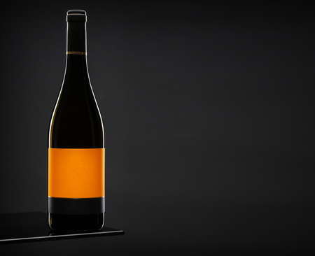 Red wine bottle on dark backgroundの写真素材