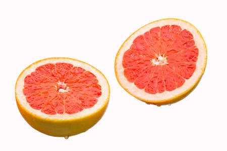 Fresh grapefruit slices, isolated on a white backgroundの写真素材