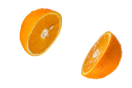 half ripe oranges isolated on a white backgroundの写真素材
