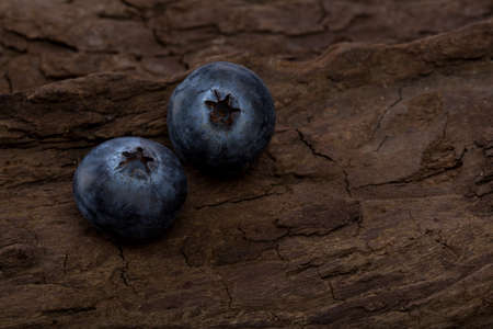 Blueberries ripe and tasty on a wooden tableの写真素材