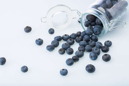 Fresh organic blueberries in transparent glassの写真素材