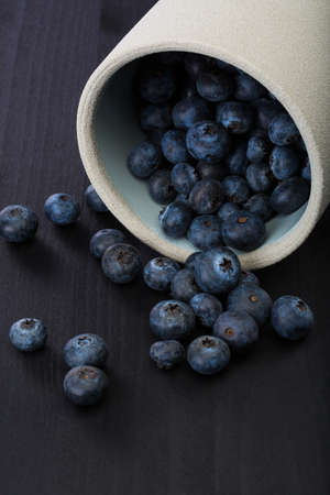 Close up of a blueberries on a wood table.の写真素材