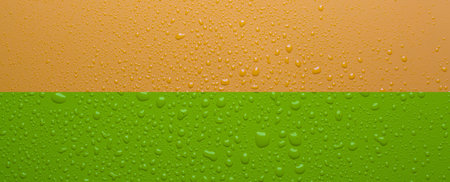 Water drops on orange color surfaceの写真素材