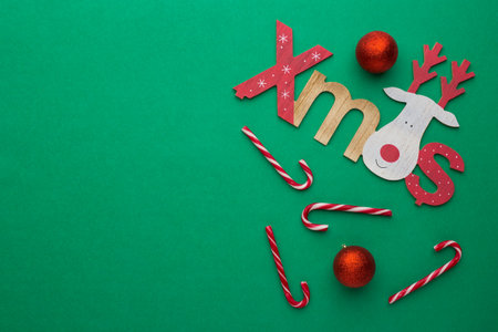 Christmas background green with decoration candies and ballの写真素材