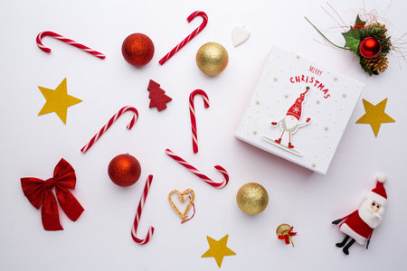 Christmas background with decoration candies and Santa's hatの写真素材