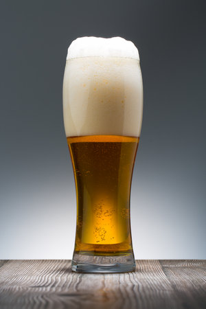 Beer. Cold Craft light Beer in a glass. Close up of a pint of beerの写真素材